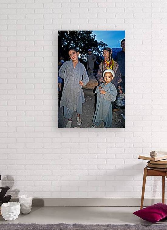 Children and adults gather in Bumburet Valley Pakistan by Marco Brivio