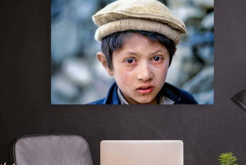Young boy at Shandur Pass in Pakistan during daytime by Marco Brivio