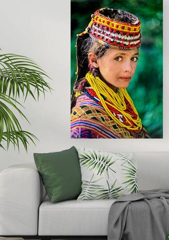 Kalash woman in traditional attire stands outdoors in Pakistan by Marco Brivio