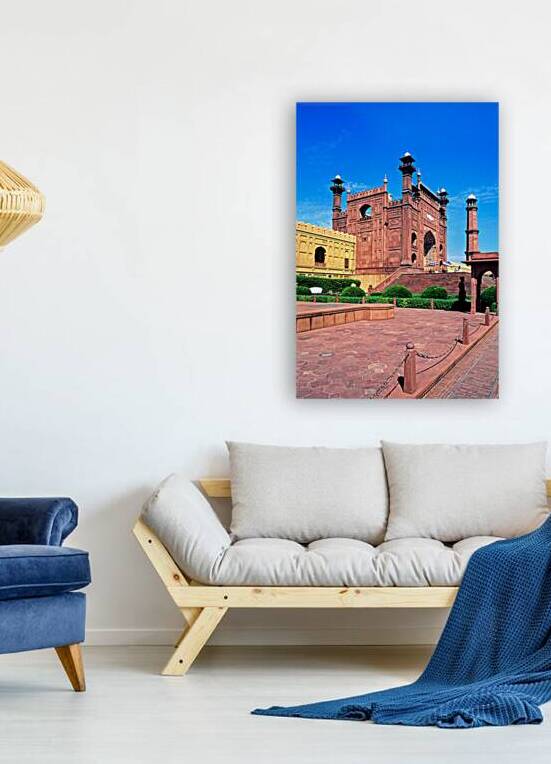 Mosque stands tall in Lahore with clear blue sky above by Marco Brivio