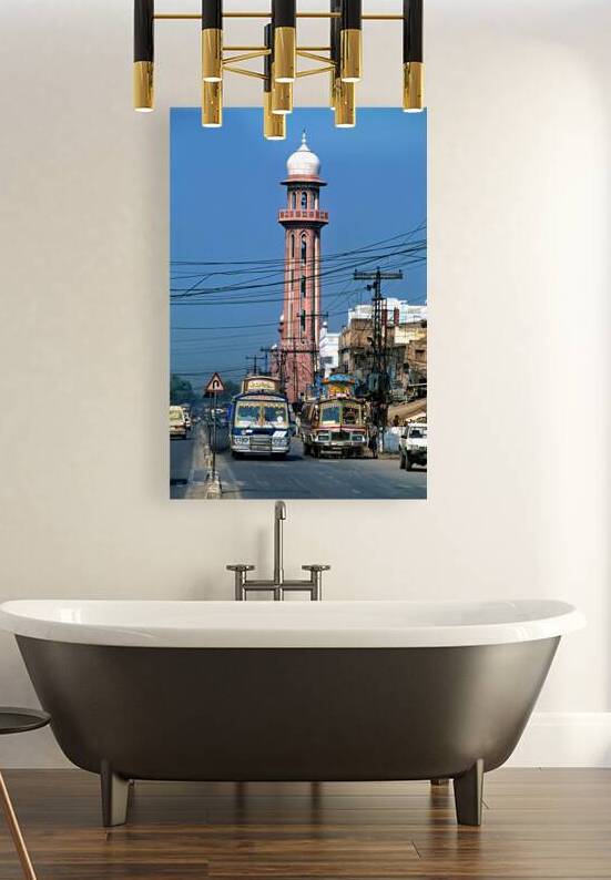 Busy street scene with tall tower in Peshawar Pakistan by Marco Brivio