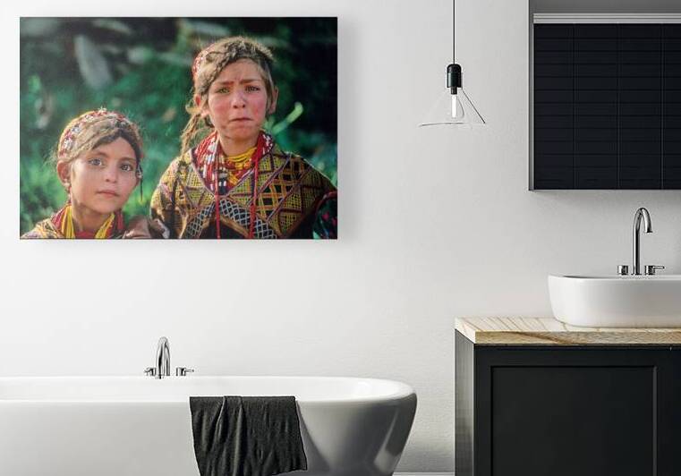 Children of Pakistan wear traditional clothing in the sunlight by Marco Brivio