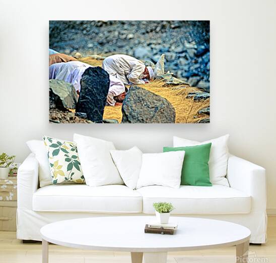 Muslim men pray towards Mecca in Pakistan during prayer time by Marco Brivio