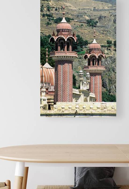 Mosque towers stand tall in Chitral Pakistan on a clear day by Marco Brivio