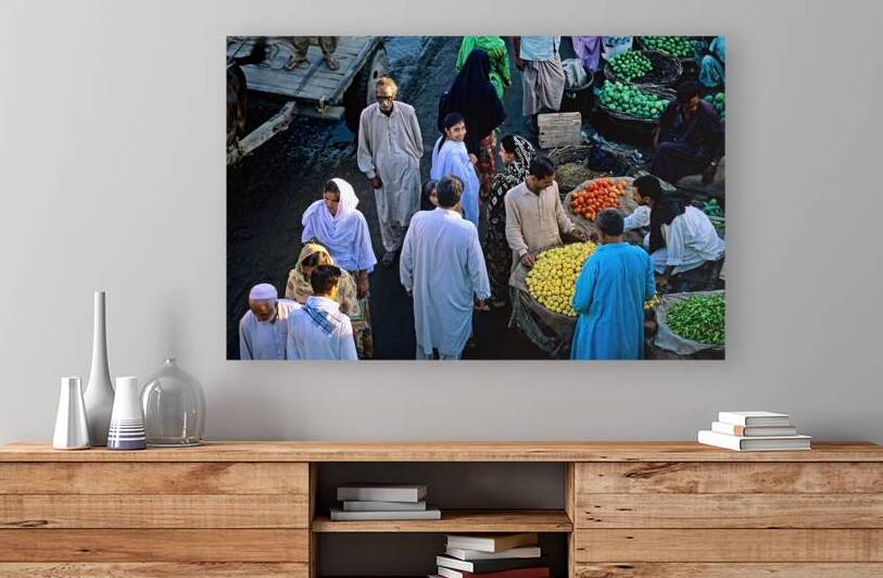 Busy street market in Lahore filled with vendors and shoppers by Marco Brivio