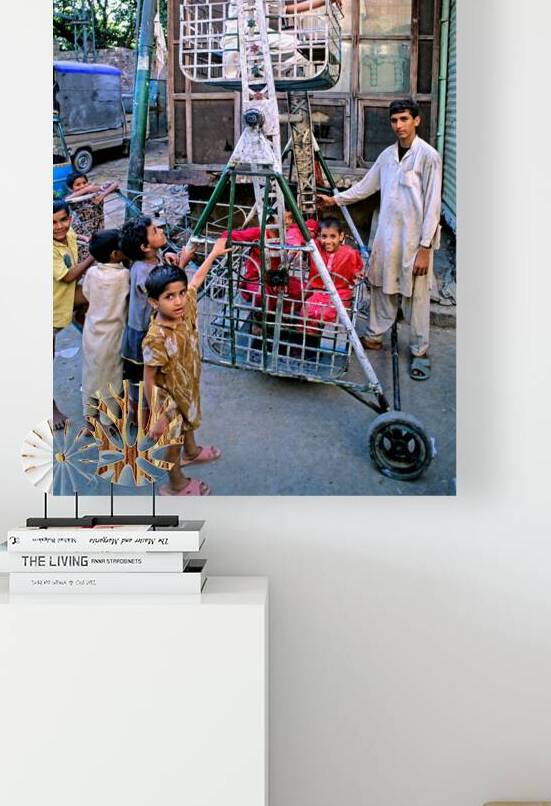 Children enjoy playtime on a swing in Lahore by Marco Brivio