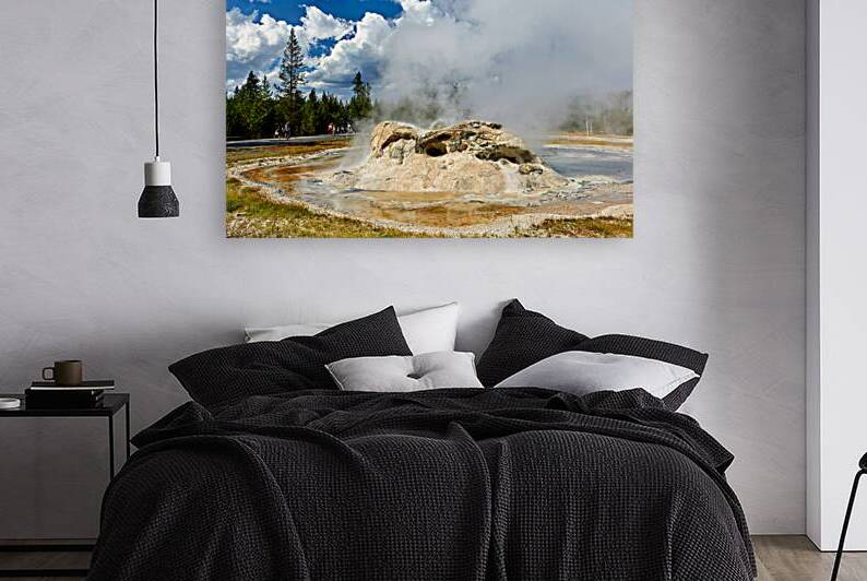 Grotto Geyser erupts in Yellowstone National Park on a sunny day by Marco Brivio