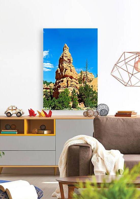 Rock formation towers over trees in Dixie National Forest by Marco Brivio