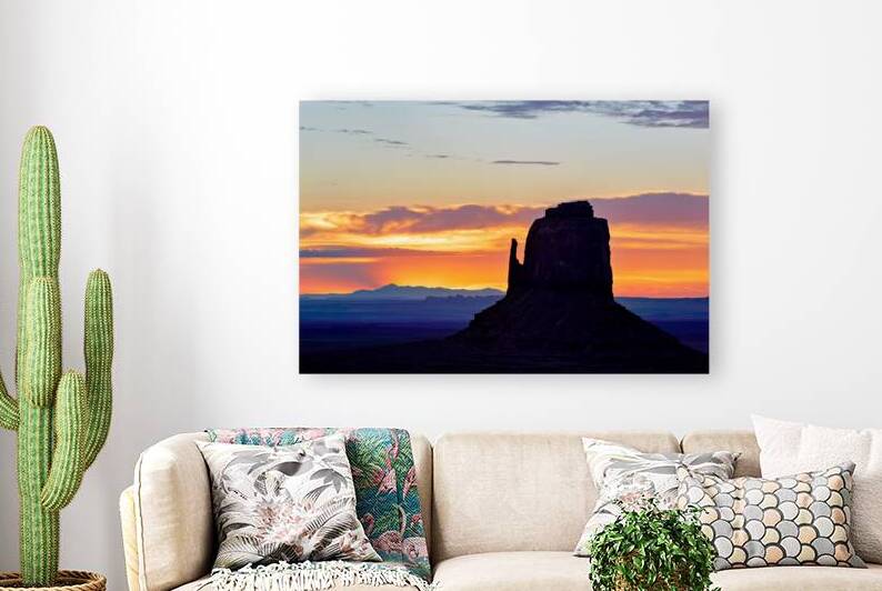 Sunset view over Monument Valley in Utah with dark silhouettes by Marco Brivio