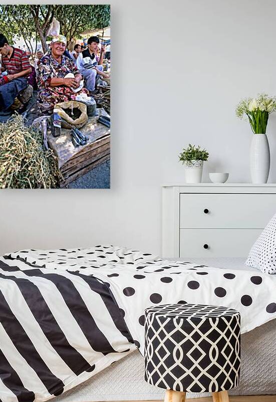 Local woman prepares herbs at market in Khiva Uzbekistan by Marco Brivio