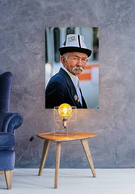 Elderly man in traditional hat walks in Bukhara Uzbekistan by Marco Brivio