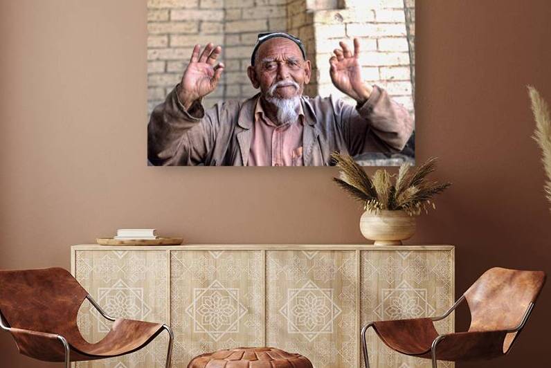 Man gestures in Khiva Uzbekistan during a sunny day by Marco Brivio