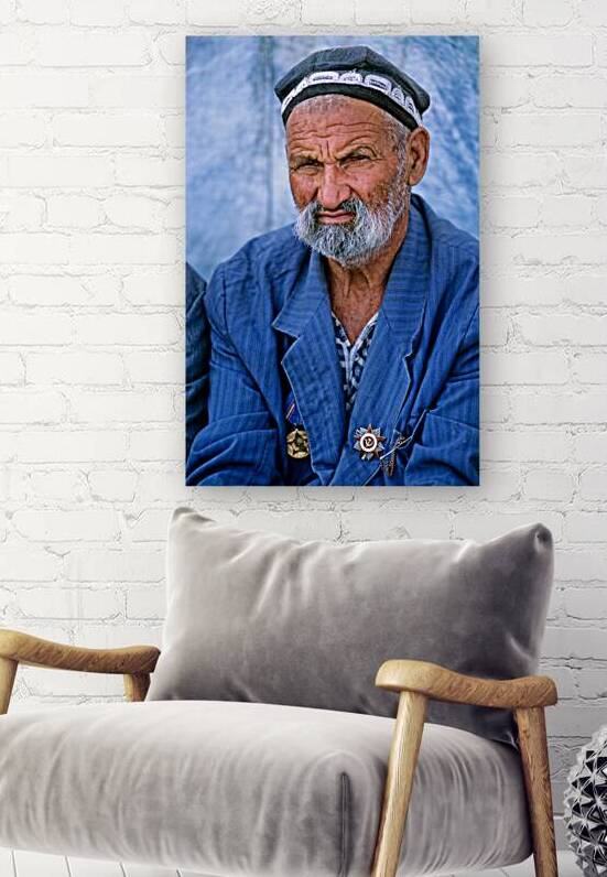 Elderly man in Bukhara Uzbekistan engages in local culture by Marco Brivio