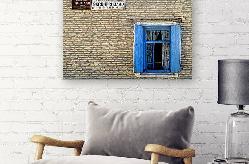 Window view of a building in Khiva Uzbekistan during daytime by Marco Brivio