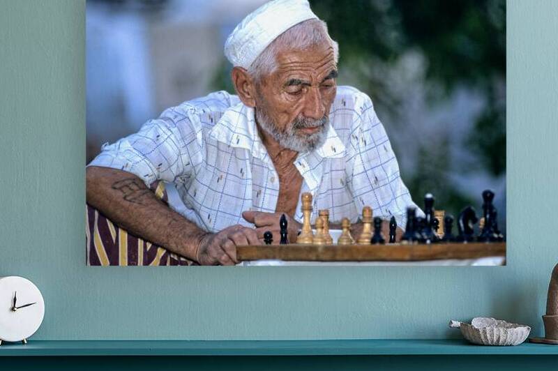 Elderly man plays chess in Bukhara Uzbekistan by Marco Brivio