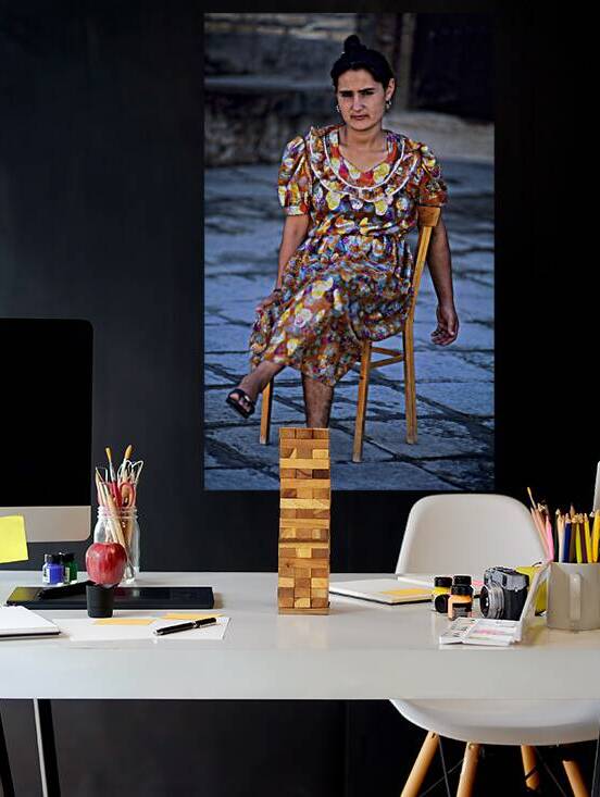 Woman sitting on a chair in Khiva Uzbekistan by Marco Brivio