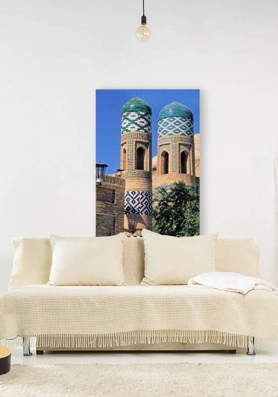 Exploring historic towers in Khiva Uzbekistan under clear sky by Marco Brivio