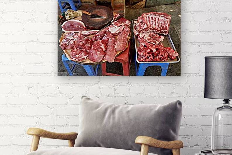 Fresh meat sold in Hanoi market during daytime by Marco Brivio