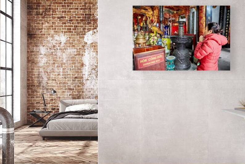 Praying at a temple in Ho Chi Minh City Vietnam by Marco Brivio