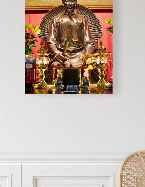 Statue of a historic figure in Hanoi Vietnam during the day by Marco Brivio