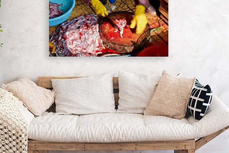 Fish preparation at a market in Hanoi during the day by Marco Brivio