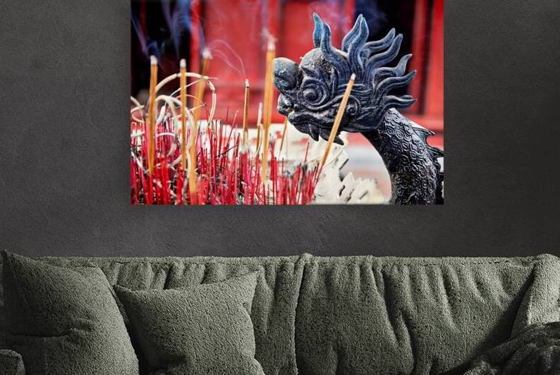 Incense and dragon decor in Hanoi Vietnam during prayer time by Marco Brivio