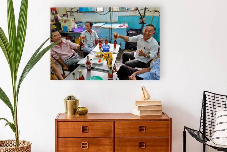 Local men enjoying drinks and food in Ho Chi Minh City by Marco Brivio