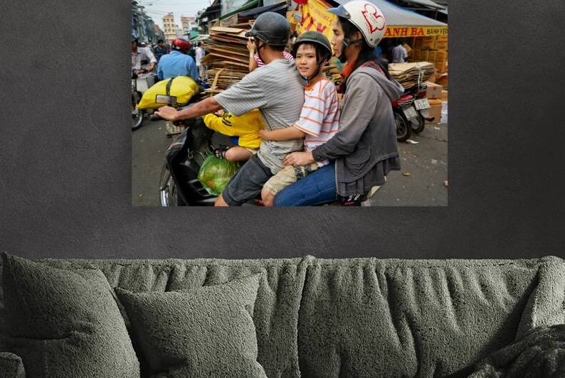Traffic in Ho Chi Minh City with a family on a motorbike by Marco Brivio