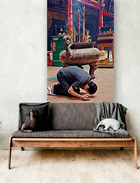 Man praying at a shrine in Ho Chi Minh City Vietnam by Marco Brivio