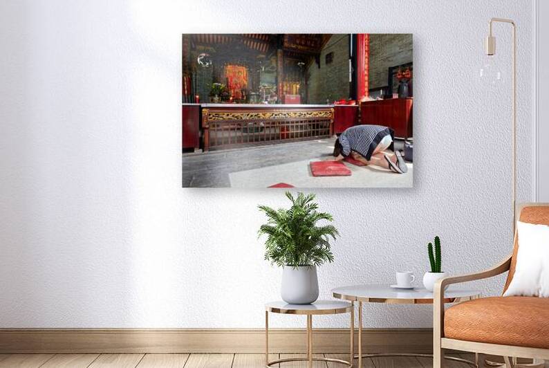 Worshippers at a temple in Ho Chi Minh Vietnam by Marco Brivio