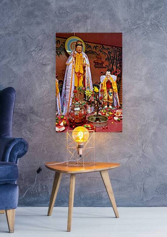 Offerings and prayers at a temple in Ho Chi Minh City by Marco Brivio