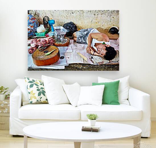 Man resting by meat stall in Ho Chi Minh City by Marco Brivio