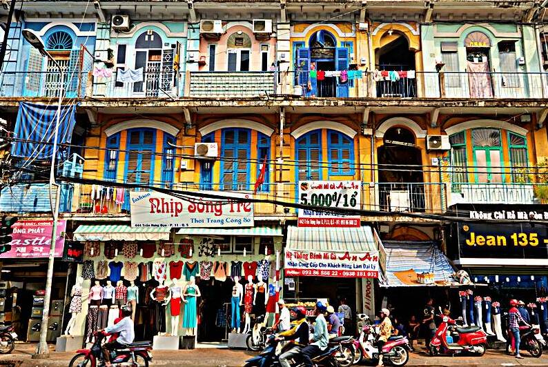 Shopping in Ho Chi Minh City streets during a sunny day by Marco Brivio