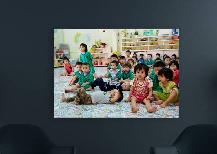 Children gather in classroom in Ho Chi Minh City during lesson by Marco Brivio