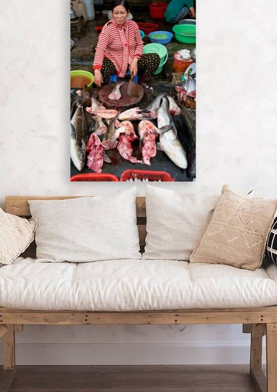 Fish seller prepares fresh catch in Phu Quoc market by Marco Brivio