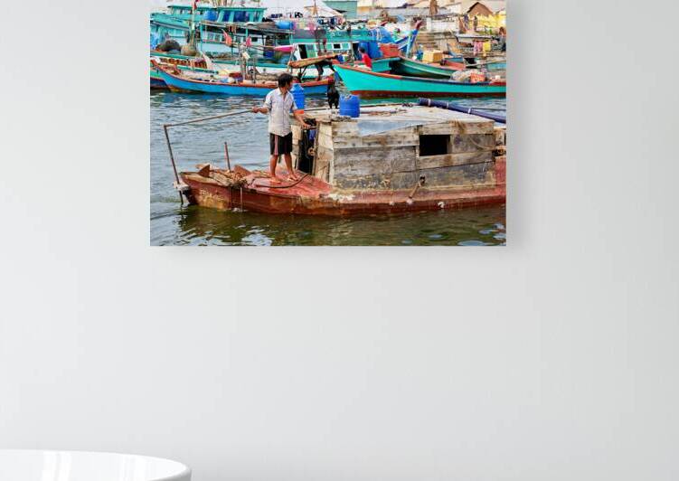 Fishing boat on water in Phu Quoc Vietnam during the day by Marco Brivio