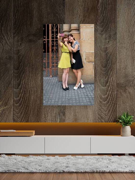 Two women take a selfie in Ho Chi Minh City by Marco Brivio