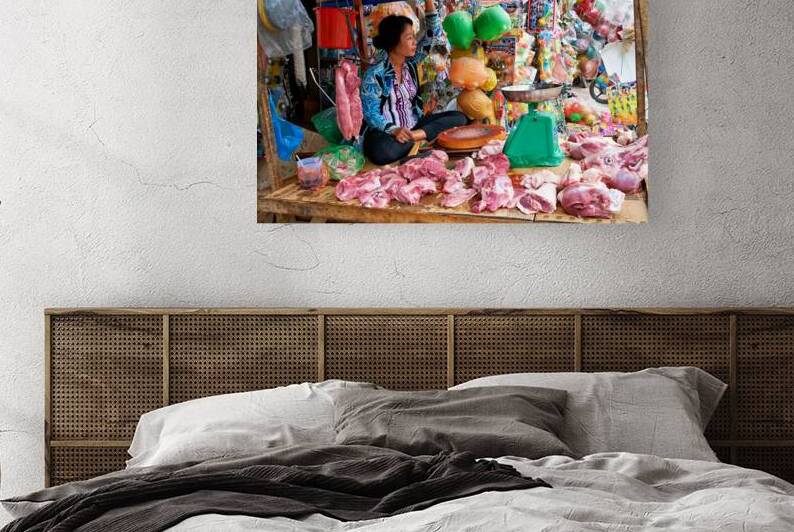 Market scene in Phu Quoc with seller and meat display by Marco Brivio