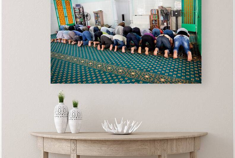 Men praying in a mosque in Ho Chi Minh City Vietnam by Marco Brivio