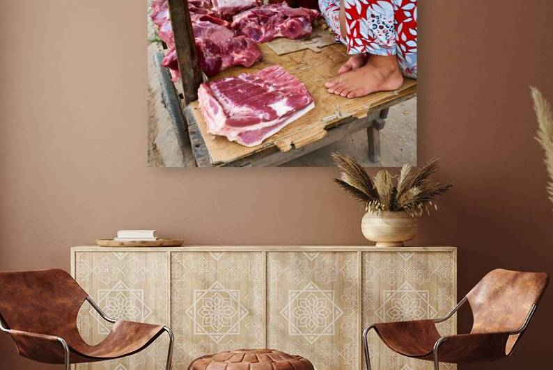 Fresh meat vendor in Phu Quoc market during daytime by Marco Brivio