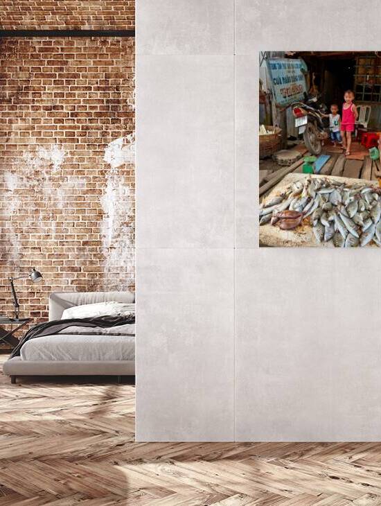 Children at a fish stall in Phu Quoc Vietnam during the day by Marco Brivio