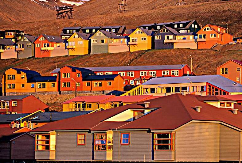 Colorful buildings in Longyearbyen Svalbard at sunset by Marco Brivio