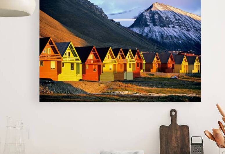 Colorful houses in Longyearbyen Svalbard during sunset by Marco Brivio