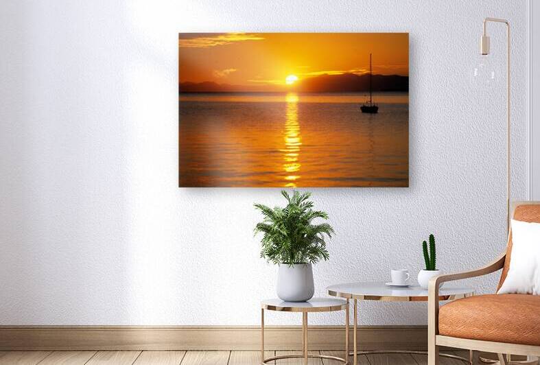 Midnight sun at Longyearbyen in Svalbard with a boat on the water by Marco Brivio