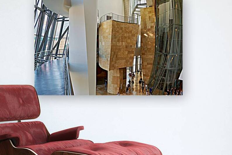 Inside Guggenheim Museum in Bilbao Spain with visitors walking by Marco Brivio