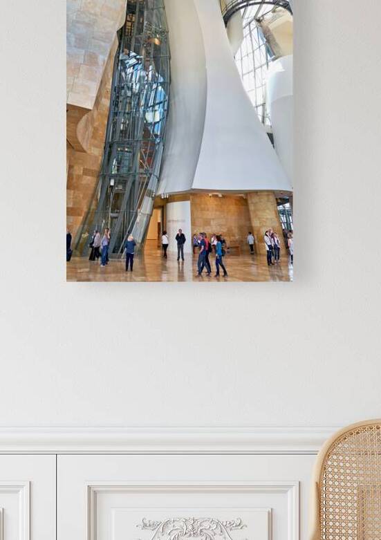 Visitors explore the interior of the Guggenheim Museum in Bilbao by Marco Brivio