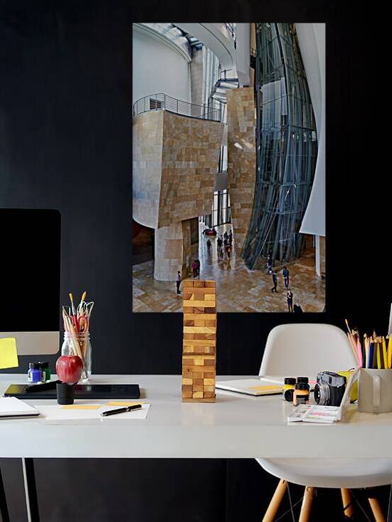 People walk through the Guggenheim Museum in Bilbao Spain by Marco Brivio