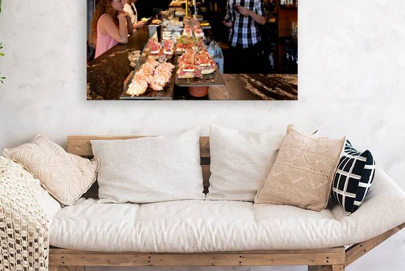 Pintxos at a bar in Bilbao Biscay Spain during a busy evening by Marco Brivio