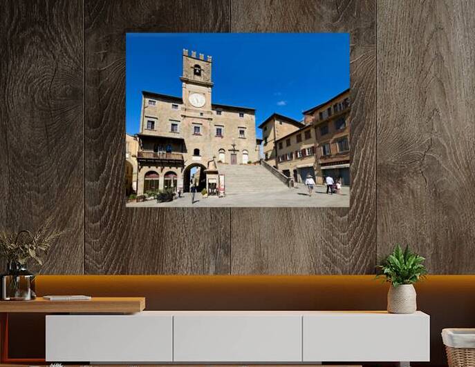 Visitors walk in Piazza della Repubblica near Palazzo del Popolo by Marco Brivio
