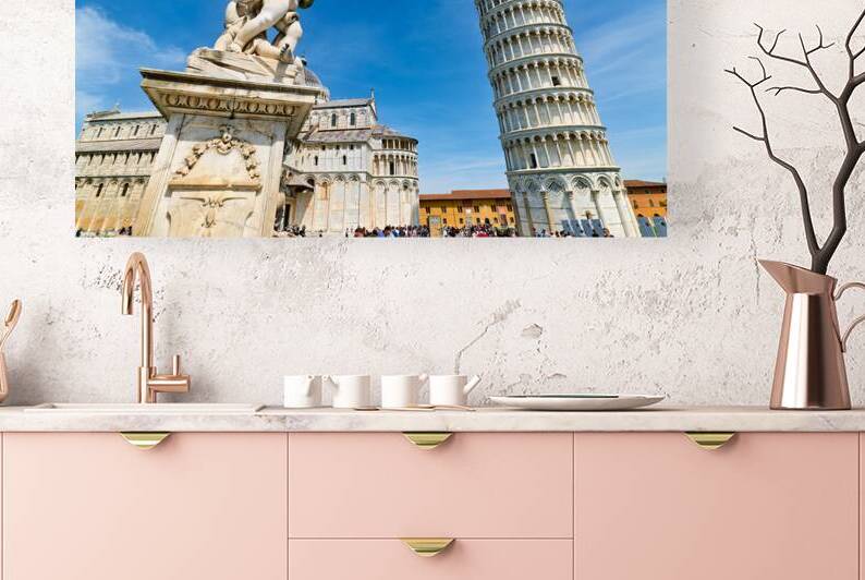 Visitors watch the Leaning Tower and the fountain of angels in Piazza dei Miracoli. Bright sky adds to the lively atmosphere in Pisa. by Marco Brivio